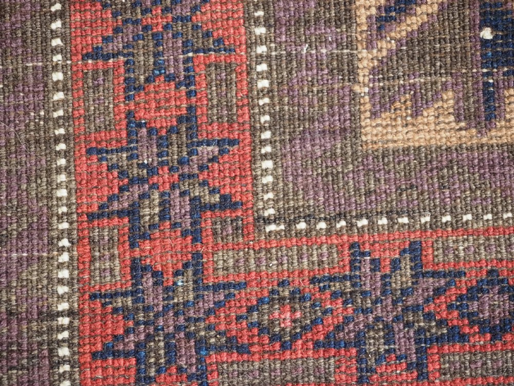 ANTIQUE BALUCH RUG WITH REPEAT LOTUS LEAF DESIGN, CIRCA 1900. View XII