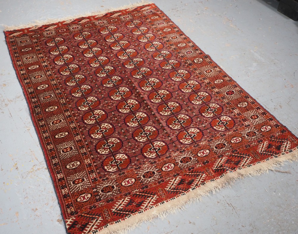 ANTIQUE TEKKE TURKMEN 'DIP KHALI' RUG WITH AUBERGINE FIELD COLOUR, CIRCA 1900. View II