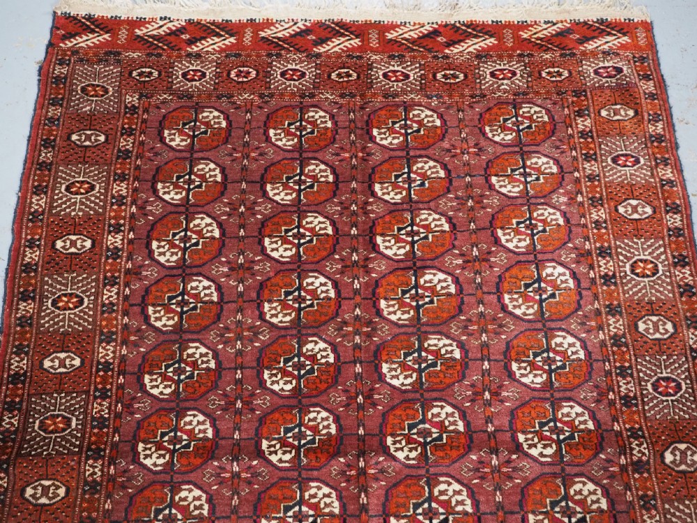 ANTIQUE TEKKE TURKMEN 'DIP KHALI' RUG WITH AUBERGINE FIELD COLOUR, CIRCA 1900. View III