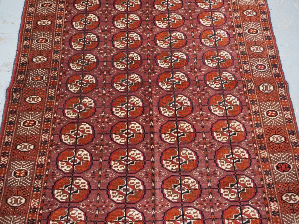 ANTIQUE TEKKE TURKMEN 'DIP KHALI' RUG WITH AUBERGINE FIELD COLOUR, CIRCA 1900. View IV