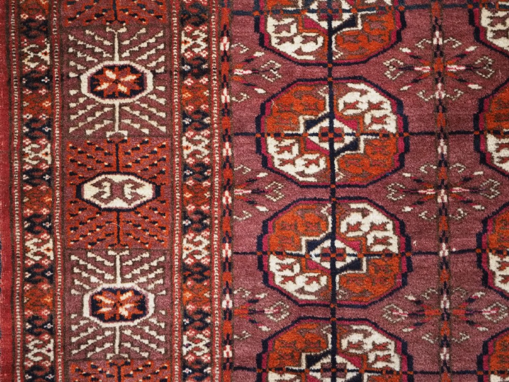 ANTIQUE TEKKE TURKMEN 'DIP KHALI' RUG WITH AUBERGINE FIELD COLOUR, CIRCA 1900. View VII