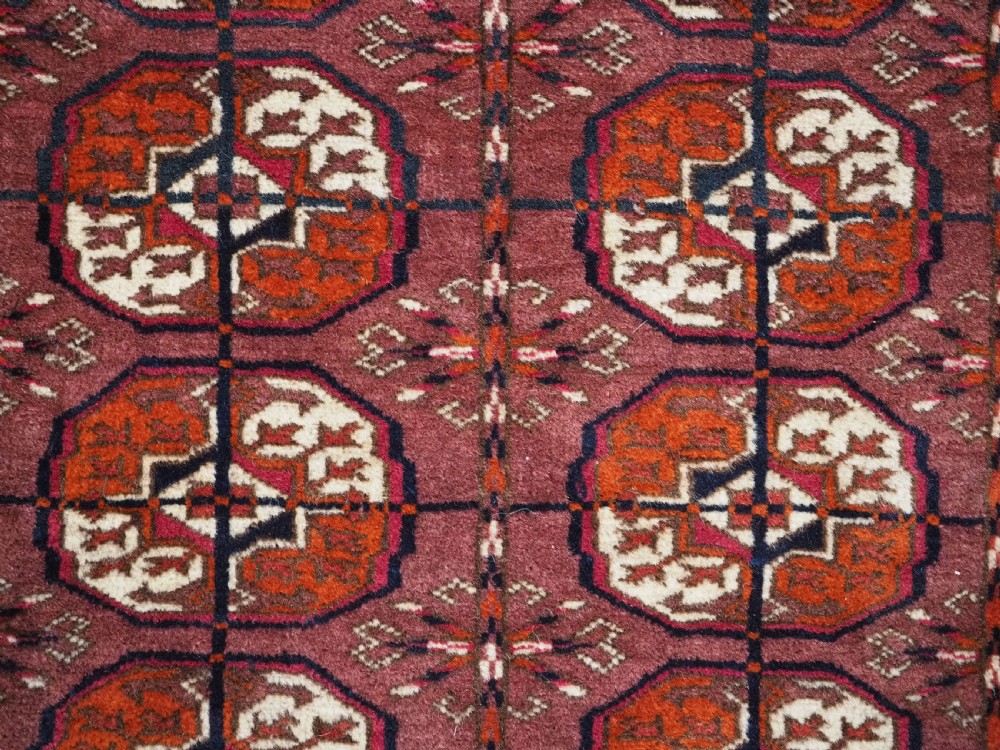 ANTIQUE TEKKE TURKMEN 'DIP KHALI' RUG WITH AUBERGINE FIELD COLOUR, CIRCA 1900. View IX
