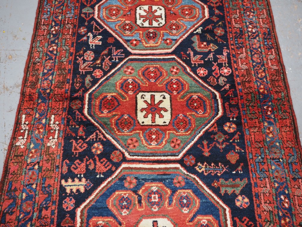 ANTIQUE KURDISH RUG OF OCTAGON DESIGN, SUPERB COLOUR & CONDITION, CIRCA 1900. View IV