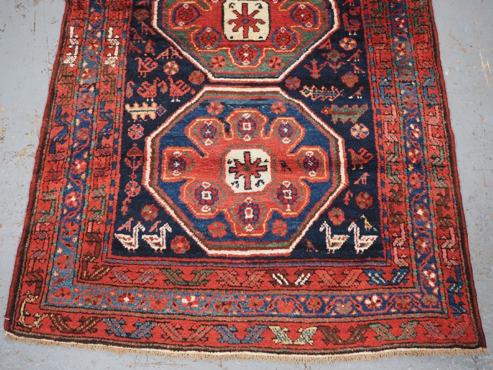 ANTIQUE KURDISH RUG OF OCTAGON DESIGN, SUPERB COLOUR & CONDITION, CIRCA 1900. View VI