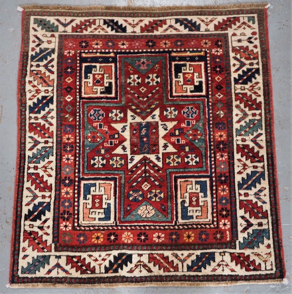 CAUCASIAN KAZAK RUG WITH STAR OF SCARCE SMALL SIZE, CIRCA 1890.