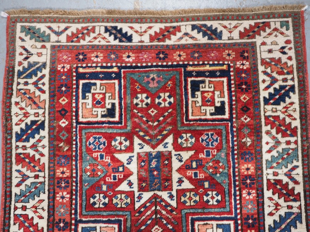 CAUCASIAN KAZAK RUG WITH STAR OF SCARCE SMALL SIZE, CIRCA 1890. View II