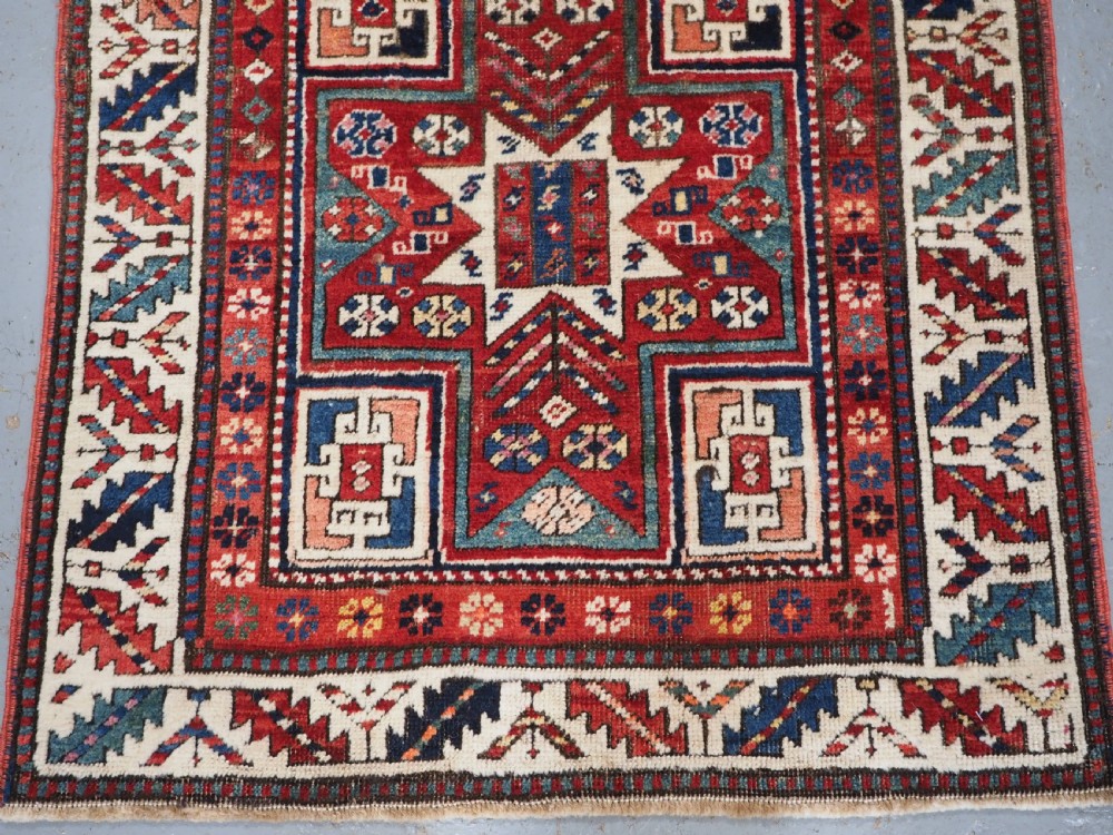 CAUCASIAN KAZAK RUG WITH STAR OF SCARCE SMALL SIZE, CIRCA 1890. View III