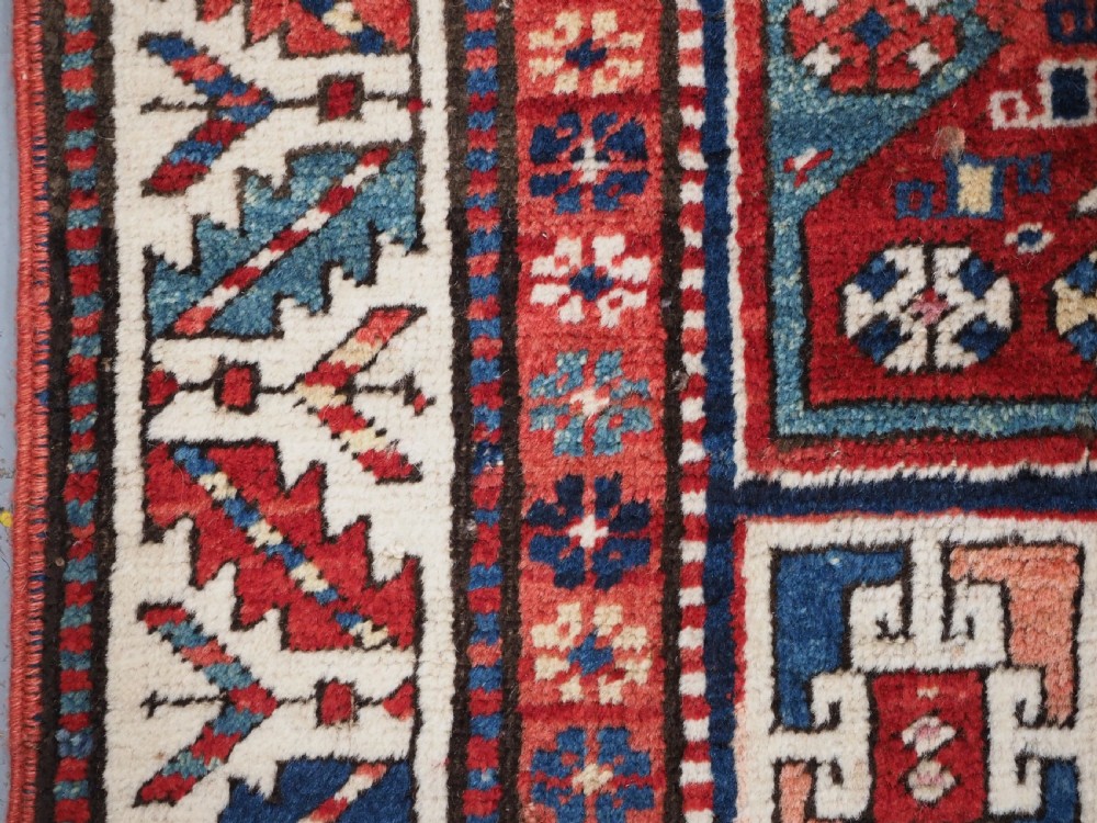 CAUCASIAN KAZAK RUG WITH STAR OF SCARCE SMALL SIZE, CIRCA 1890. View V