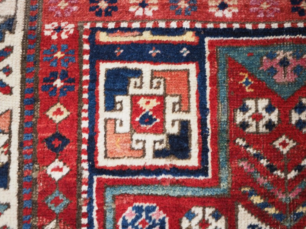 CAUCASIAN KAZAK RUG WITH STAR OF SCARCE SMALL SIZE, CIRCA 1890. View VI