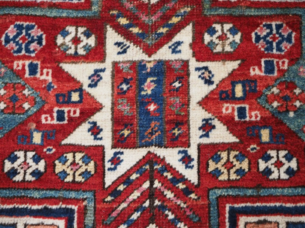 CAUCASIAN KAZAK RUG WITH STAR OF SCARCE SMALL SIZE, CIRCA 1890. View VIII