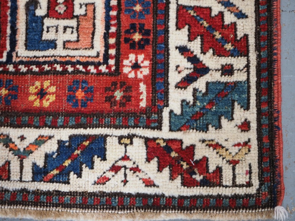 CAUCASIAN KAZAK RUG WITH STAR OF SCARCE SMALL SIZE, CIRCA 1890. View X