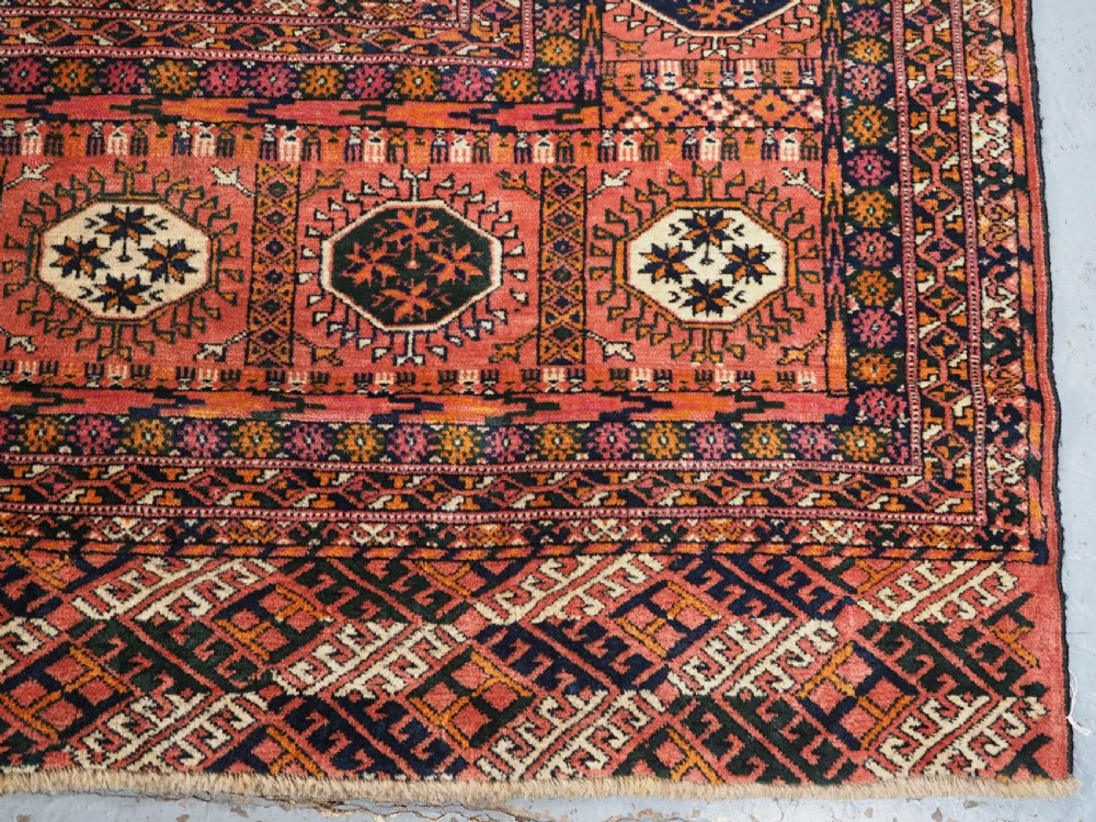 ANTIQUE TEKKE TURKMEN MAIN CARPET IN A SOFT WARM PINK / RED COLOUR, CIRCA 1900. View XII