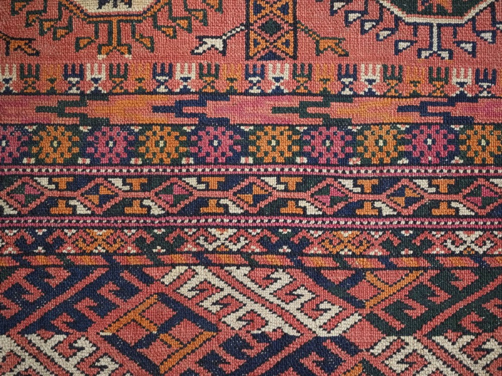 ANTIQUE TEKKE TURKMEN MAIN CARPET IN A SOFT WARM PINK / RED COLOUR, CIRCA 1900. View XIII