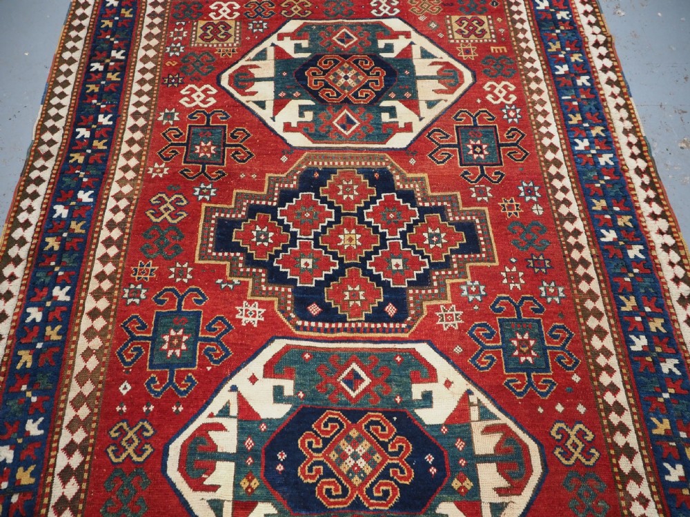 ANTIQUE CAUCASIAN TRIPLE MEDALLION KAZAK RUG, CLASSIC DESIGN, 2ND HALF 19TH CENTURY. View IV