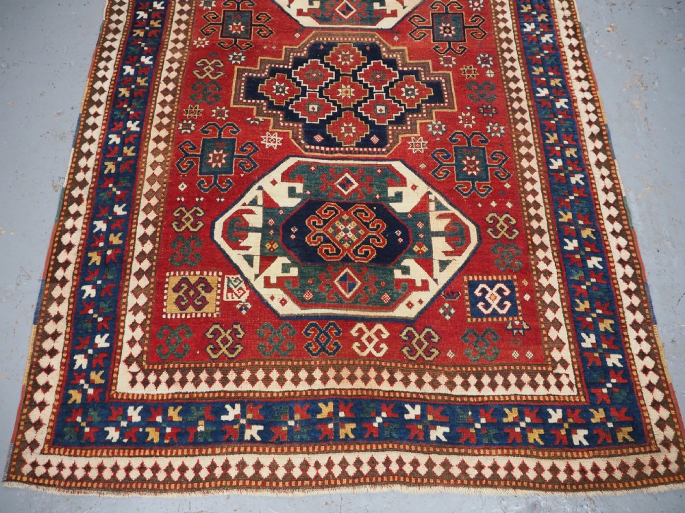 ANTIQUE CAUCASIAN TRIPLE MEDALLION KAZAK RUG, CLASSIC DESIGN, 2ND HALF 19TH CENTURY. View V