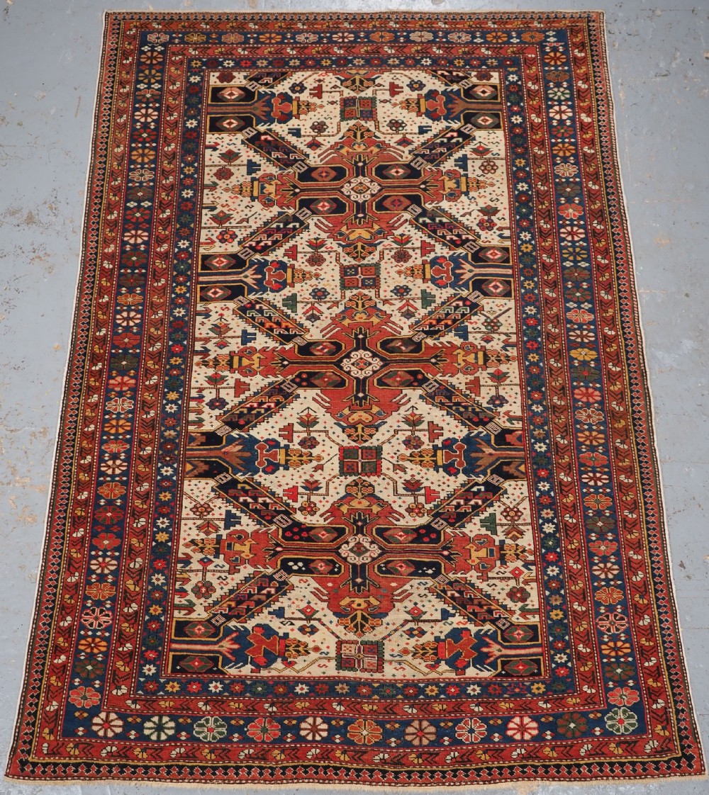 ANTIQUE CAUCASIAN SEICHUR RUG OF CLASSIC CROSS DESIGN, CIRCA 1880.