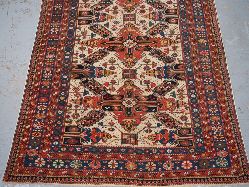 ANTIQUE CAUCASIAN SEICHUR RUG OF CLASSIC CROSS DESIGN, CIRCA 1880. View V