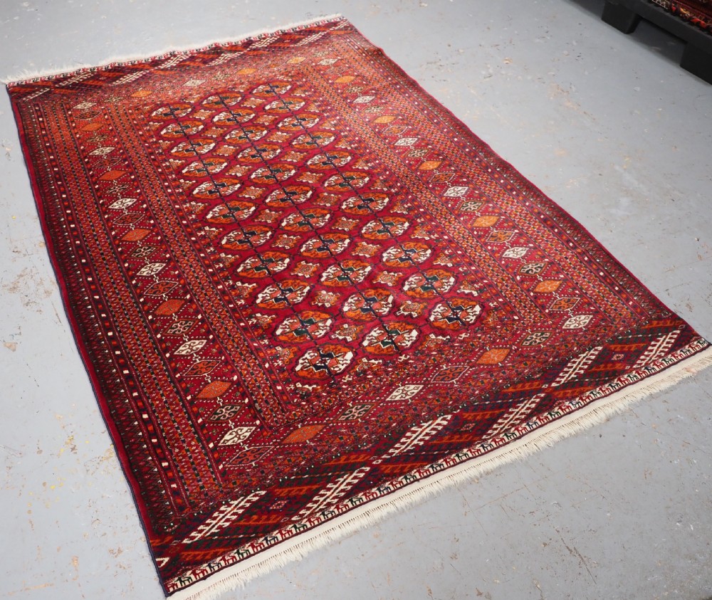 OLD TEKKE TURKMEN RUG, ROWS OF SMALL ANIMALS, CIRCA 1920/30. View II