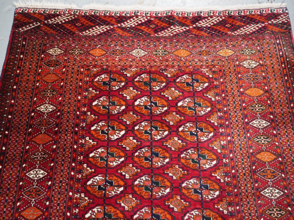OLD TEKKE TURKMEN RUG, ROWS OF SMALL ANIMALS, CIRCA 1920/30. View III