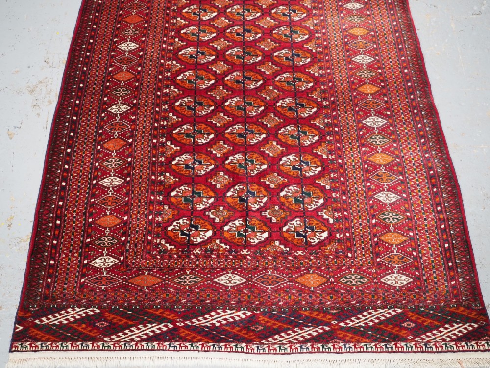 OLD TEKKE TURKMEN RUG, ROWS OF SMALL ANIMALS, CIRCA 1920/30. View IV