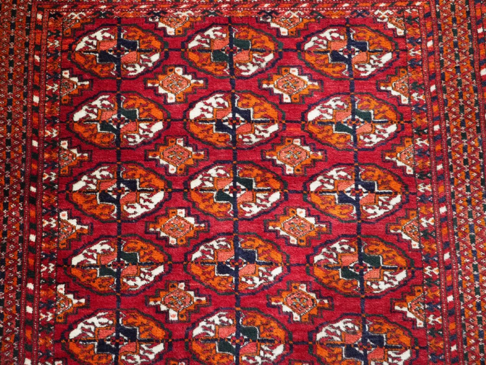 OLD TEKKE TURKMEN RUG, ROWS OF SMALL ANIMALS, CIRCA 1920/30. View VIII