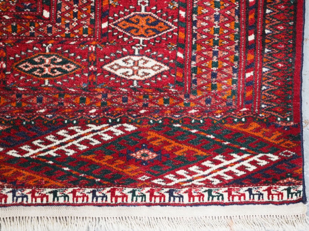OLD TEKKE TURKMEN RUG, ROWS OF SMALL ANIMALS, CIRCA 1920/30. View XI