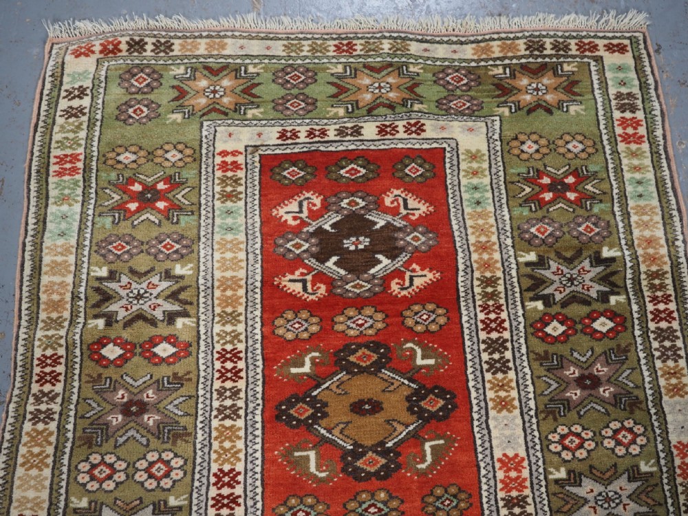 OLD TURKISH MILAS RUG OF SMALL MEDALLION DESIGN, CIRCA 1920/30. View III