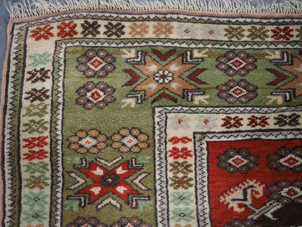 OLD TURKISH MILAS RUG OF SMALL MEDALLION DESIGN, CIRCA 1920/30. View VI