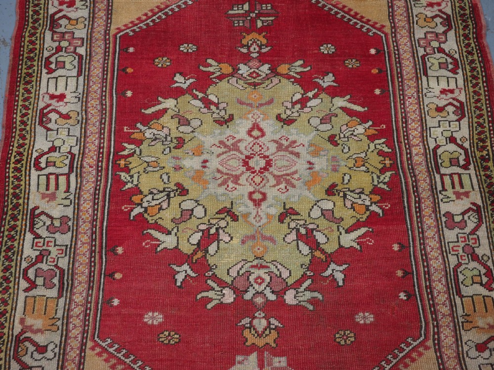 ANTIQUE TURKISH MILAS RUG, LARGE MEDALLION DESIGN, CIRCA 1900. View IV