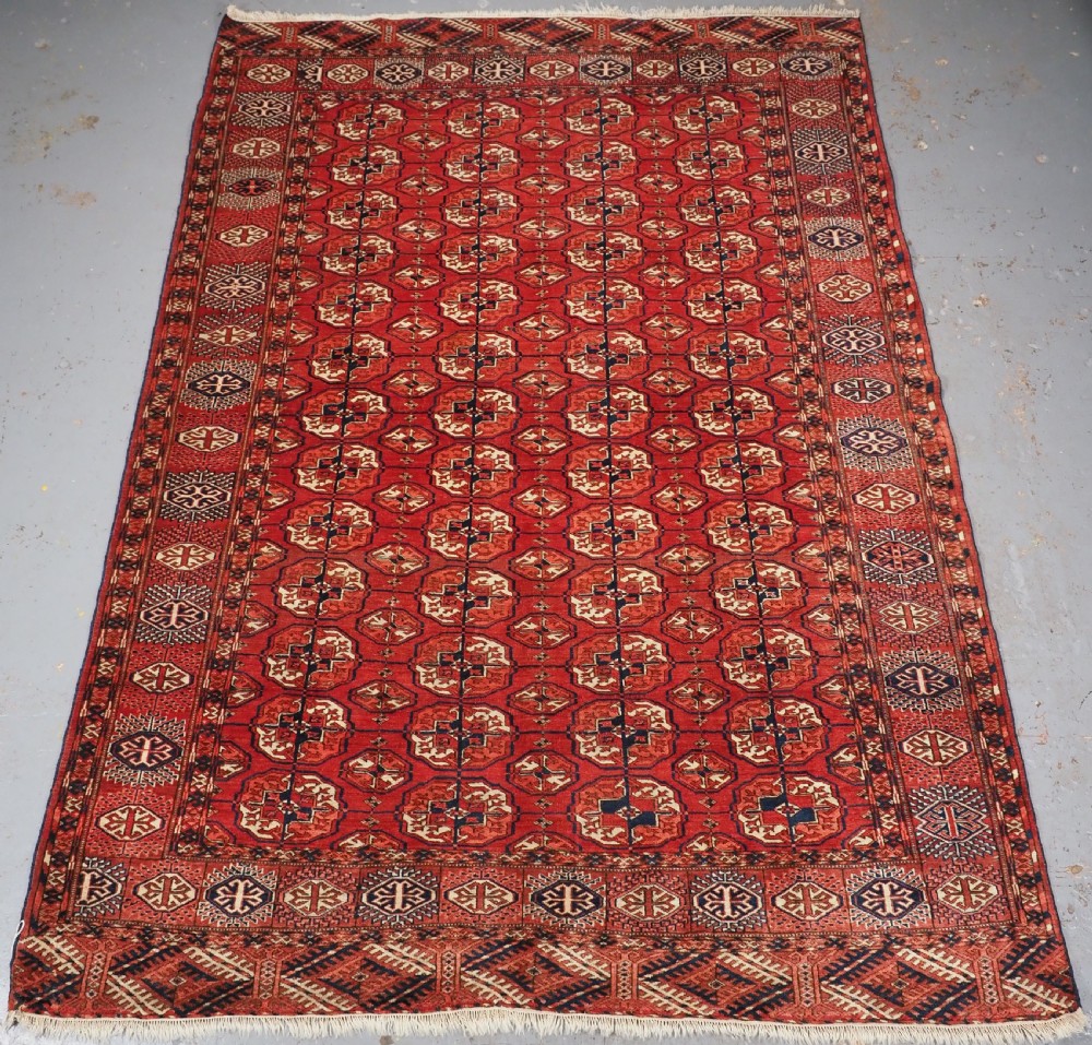 ANTIQUE TEKKE TURKMEN MAIN CARPET, SMALL SIZE WITH GOOD COLOUR, CIRCA 1890.