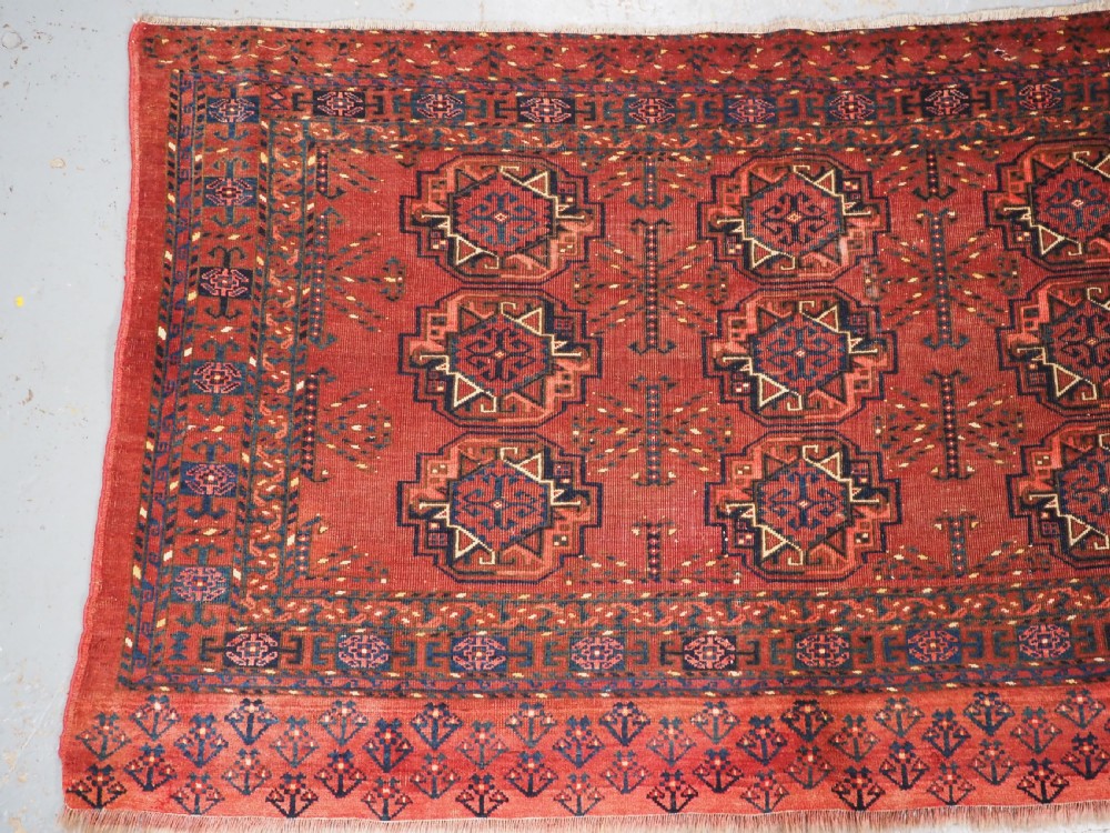 ANTIQUE ERSARI KIZIL AYAK TURKMEN NINE GUL CHUVAL, CIRCA 1900. View II