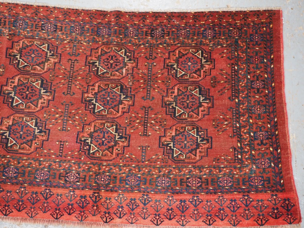 ANTIQUE ERSARI KIZIL AYAK TURKMEN NINE GUL CHUVAL, CIRCA 1900. View III