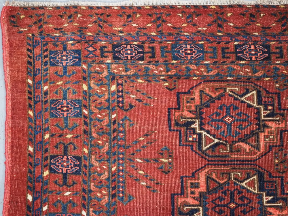 ANTIQUE ERSARI KIZIL AYAK TURKMEN NINE GUL CHUVAL, CIRCA 1900. View IV
