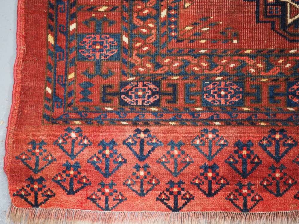 ANTIQUE ERSARI KIZIL AYAK TURKMEN NINE GUL CHUVAL, CIRCA 1900. View V