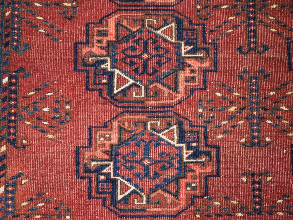 ANTIQUE ERSARI KIZIL AYAK TURKMEN NINE GUL CHUVAL, CIRCA 1900. View VI