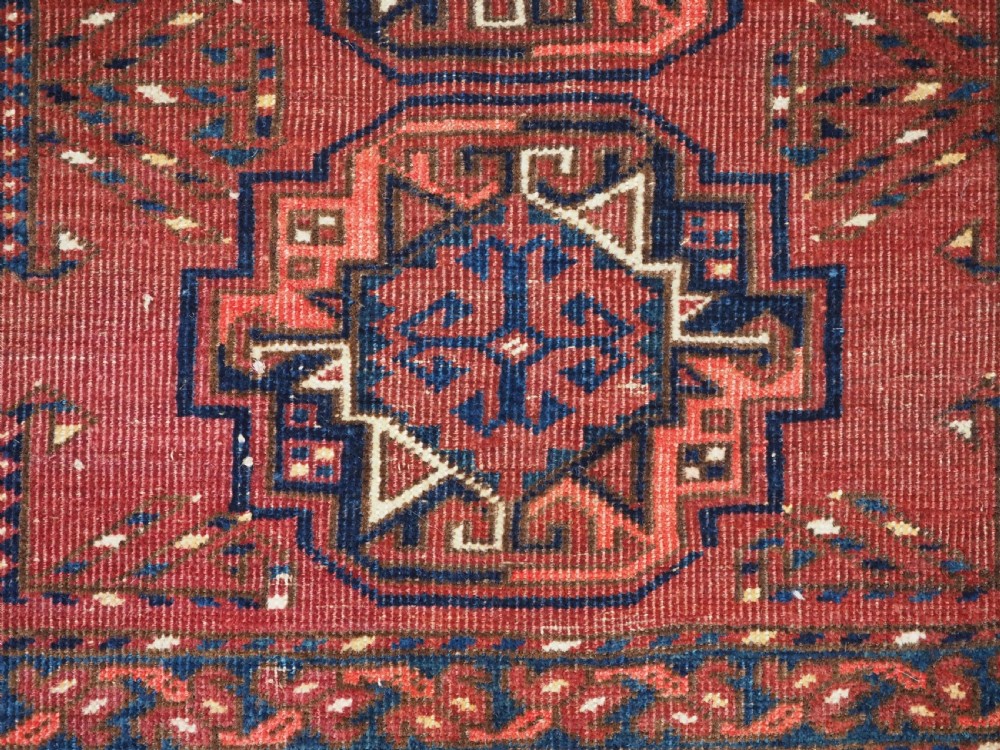 ANTIQUE ERSARI KIZIL AYAK TURKMEN NINE GUL CHUVAL, CIRCA 1900. View VIII
