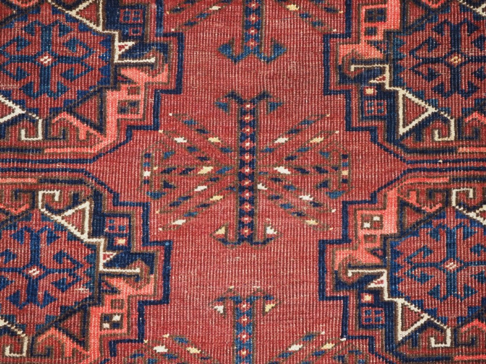 ANTIQUE ERSARI KIZIL AYAK TURKMEN NINE GUL CHUVAL, CIRCA 1900. View IX