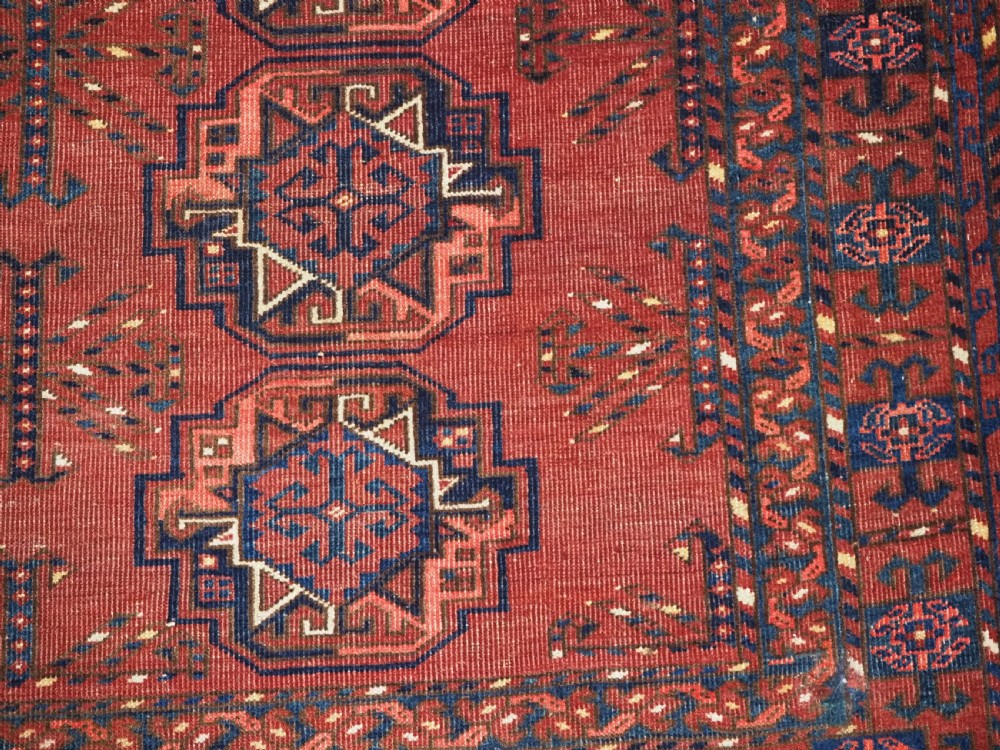 ANTIQUE ERSARI KIZIL AYAK TURKMEN NINE GUL CHUVAL, CIRCA 1900. View X