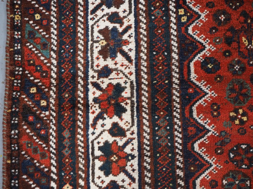ANTIQUE SHIRAZ RUG WITH LINKED MEDALLION DESIGN, CIRCA 1920. View VII