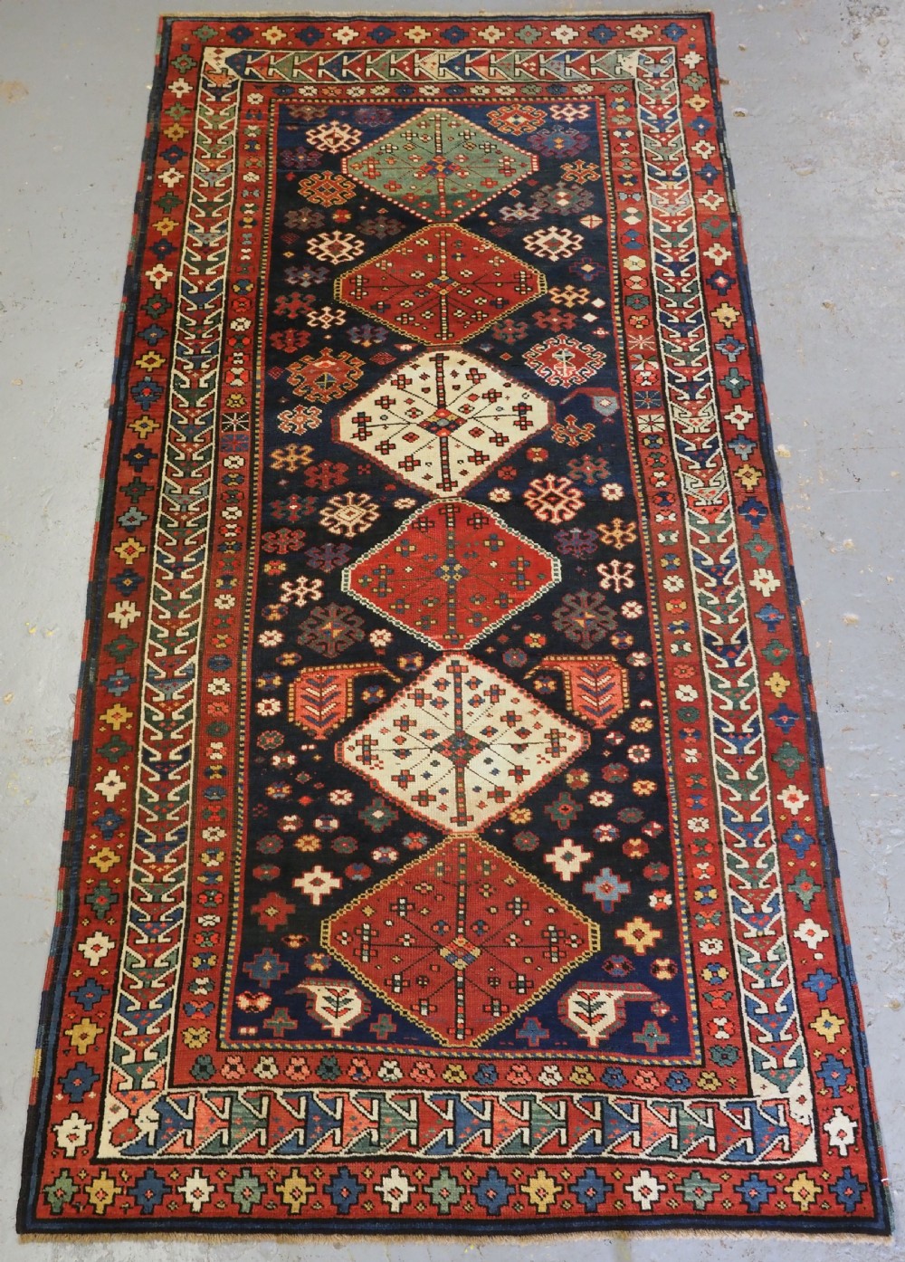 ANTIQUE CAUCASIAN SHIRVAN BAKU KHILA LONG RUG, CIRCA 1900.