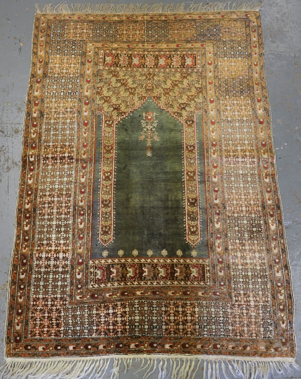 ANTIQUE TURKISH PANDERMA / BANDIRMA PRAYER RUG WITH GREEN GROUND, CIRCA 1900.
