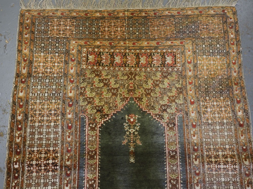 ANTIQUE TURKISH PANDERMA / BANDIRMA PRAYER RUG WITH GREEN GROUND, CIRCA 1900. View IV