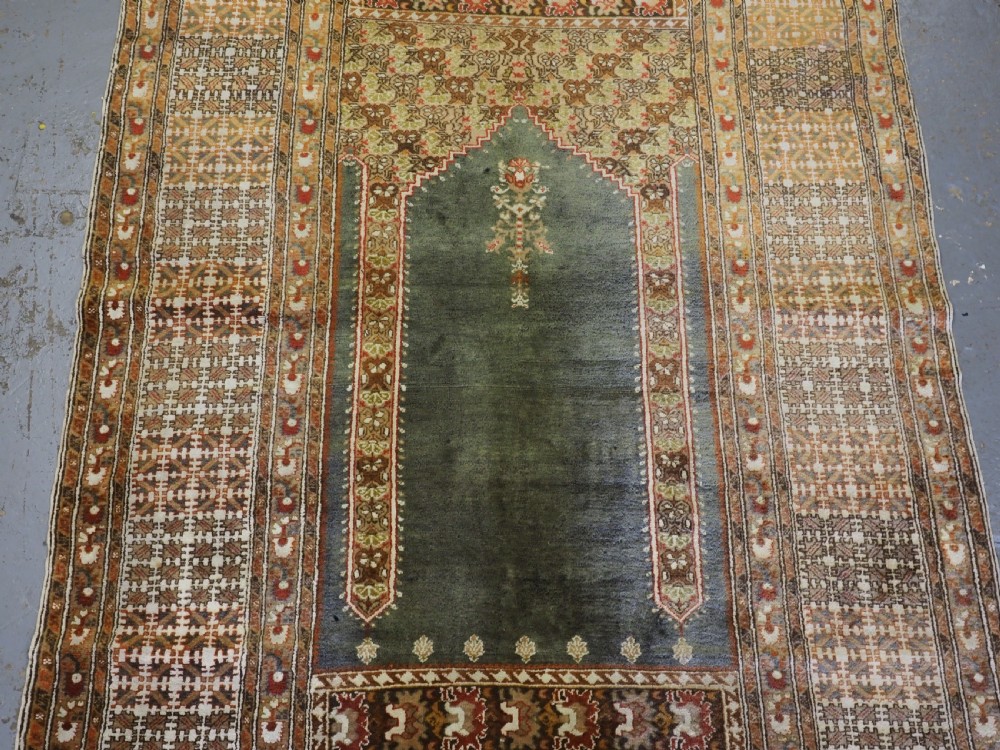 ANTIQUE TURKISH PANDERMA / BANDIRMA PRAYER RUG WITH GREEN GROUND, CIRCA 1900. View V