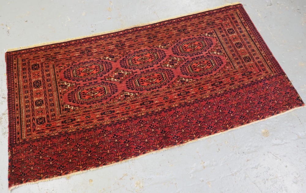 ANTIQUE TEKKE TURKMEN CHUVAL FACE WITH 'SALOR' TURRETED GULS, CIRCA 1900. View II