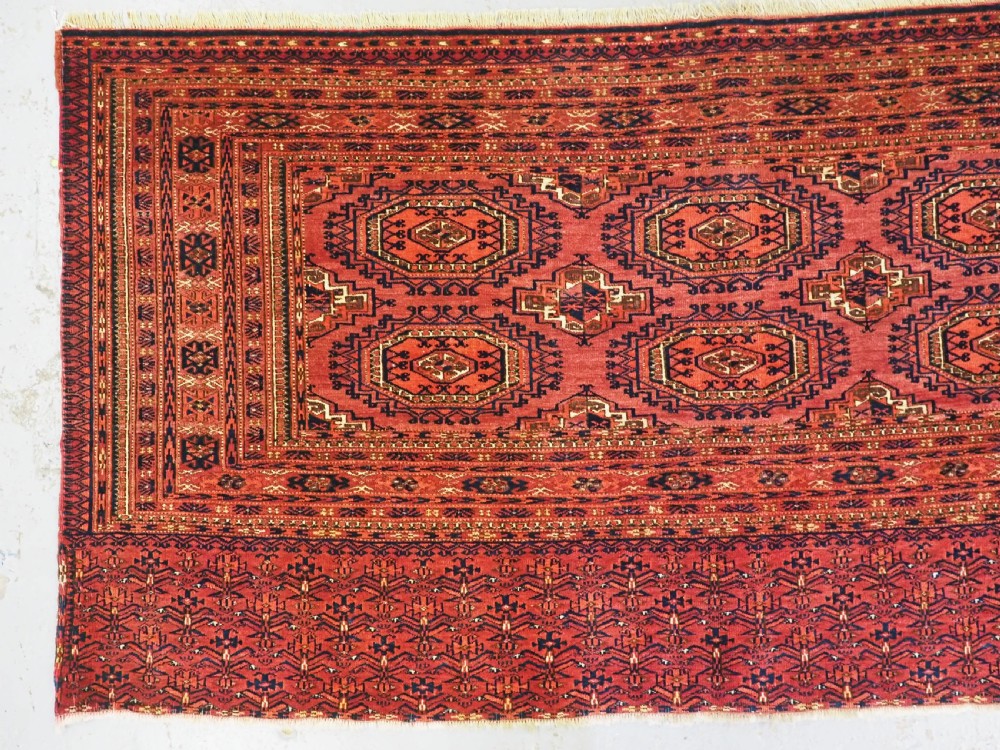 ANTIQUE TEKKE TURKMEN CHUVAL FACE WITH 'SALOR' TURRETED GULS, CIRCA 1900. View III