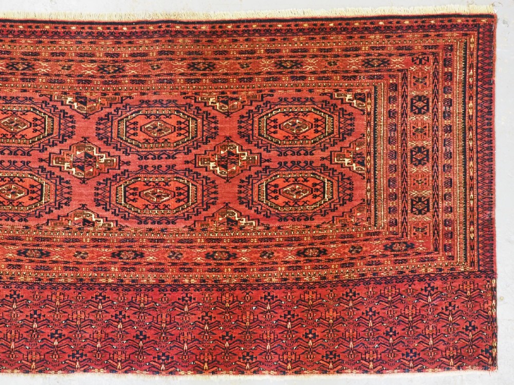 ANTIQUE TEKKE TURKMEN CHUVAL FACE WITH 'SALOR' TURRETED GULS, CIRCA 1900. View IV
