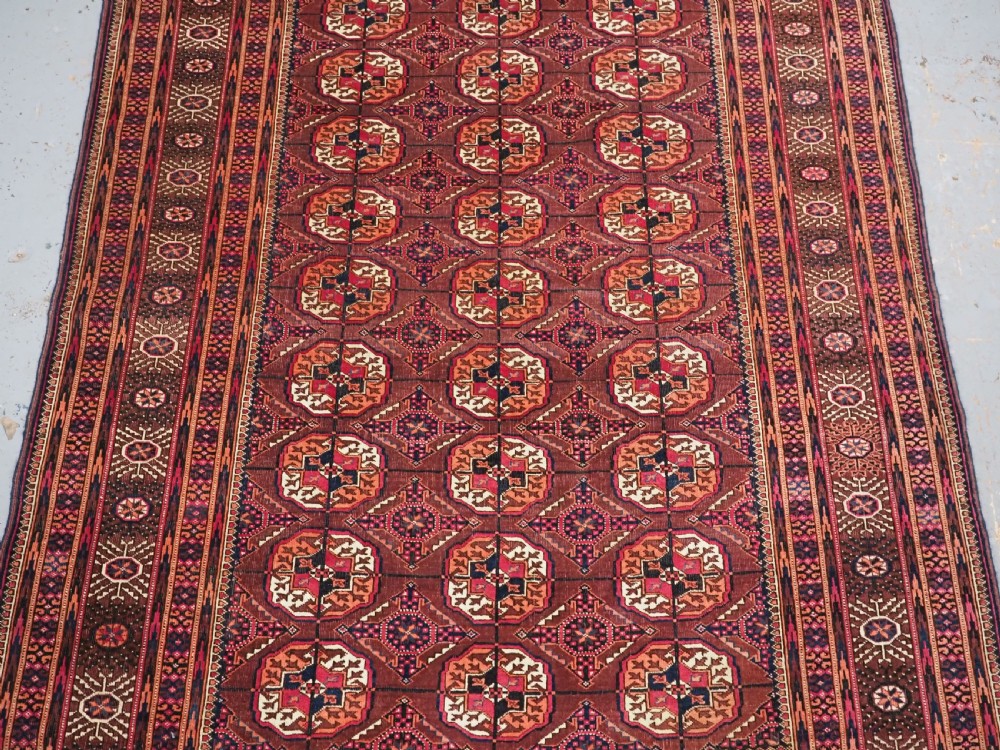ANTIQUE TEKKE TURKMEN RUG, COCHINEAL DYE HIGHLIGHTS, CIRCA 1900. View IV