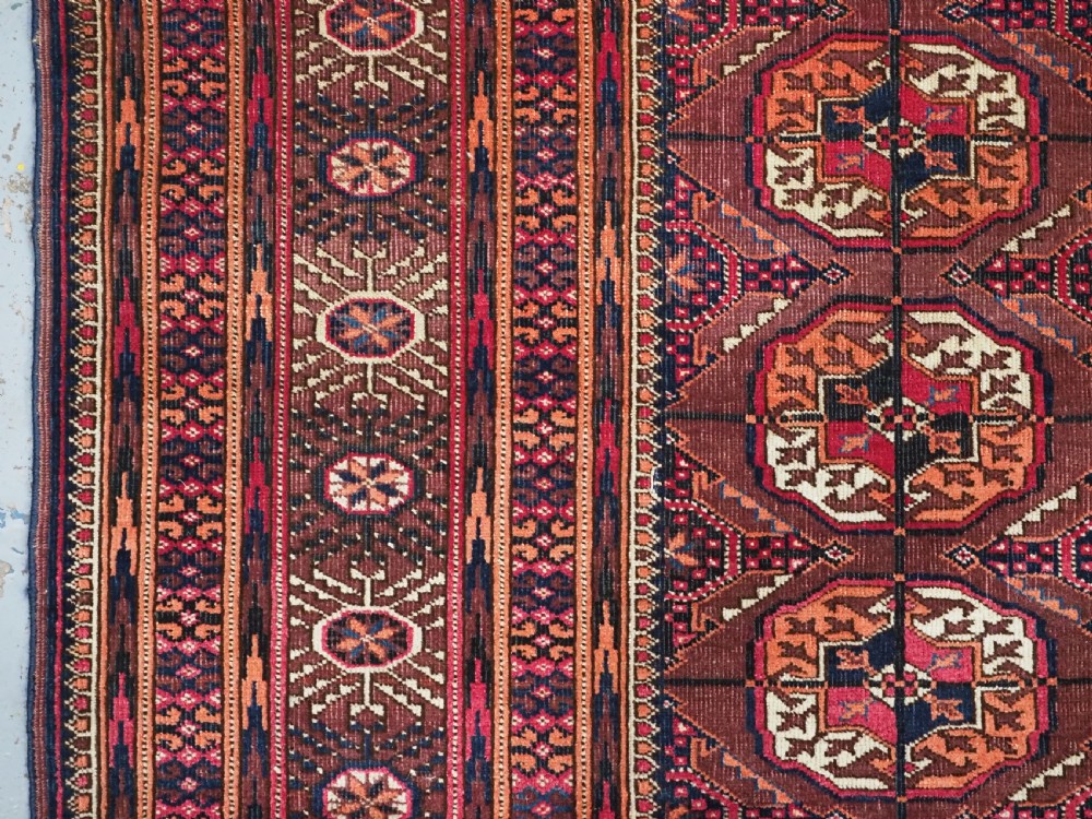 ANTIQUE TEKKE TURKMEN RUG, COCHINEAL DYE HIGHLIGHTS, CIRCA 1900. View V