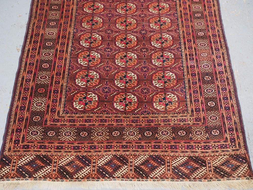 ANTIQUE TEKKE TURKMEN RUG, COCHINEAL DYE HIGHLIGHTS, CIRCA 1900. View VI