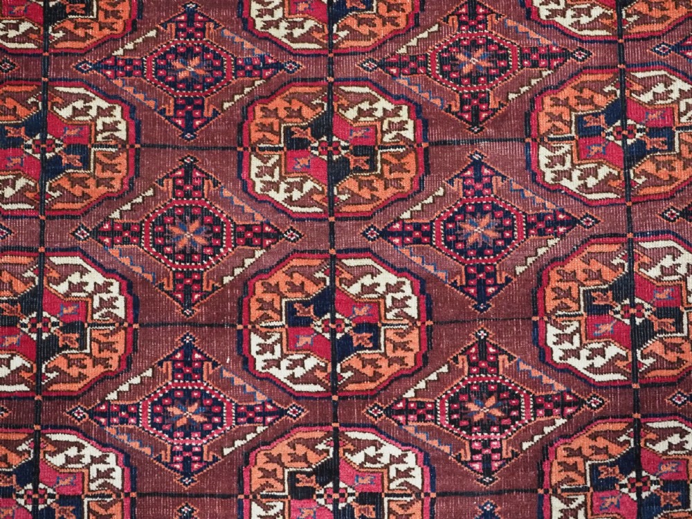 ANTIQUE TEKKE TURKMEN RUG, COCHINEAL DYE HIGHLIGHTS, CIRCA 1900. View IX